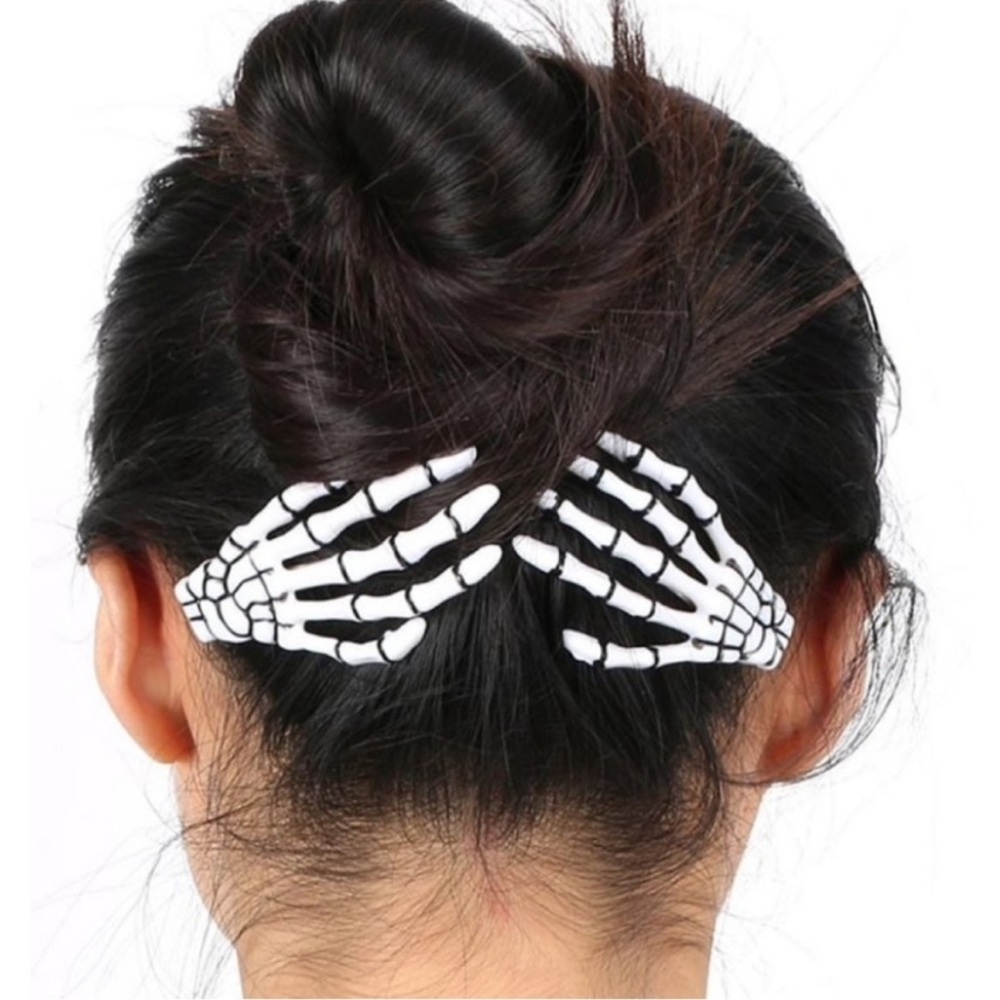 These are Scunci Glamoween Glow-in-the-Dark Skeleton Hand Hair Clips Halloween
